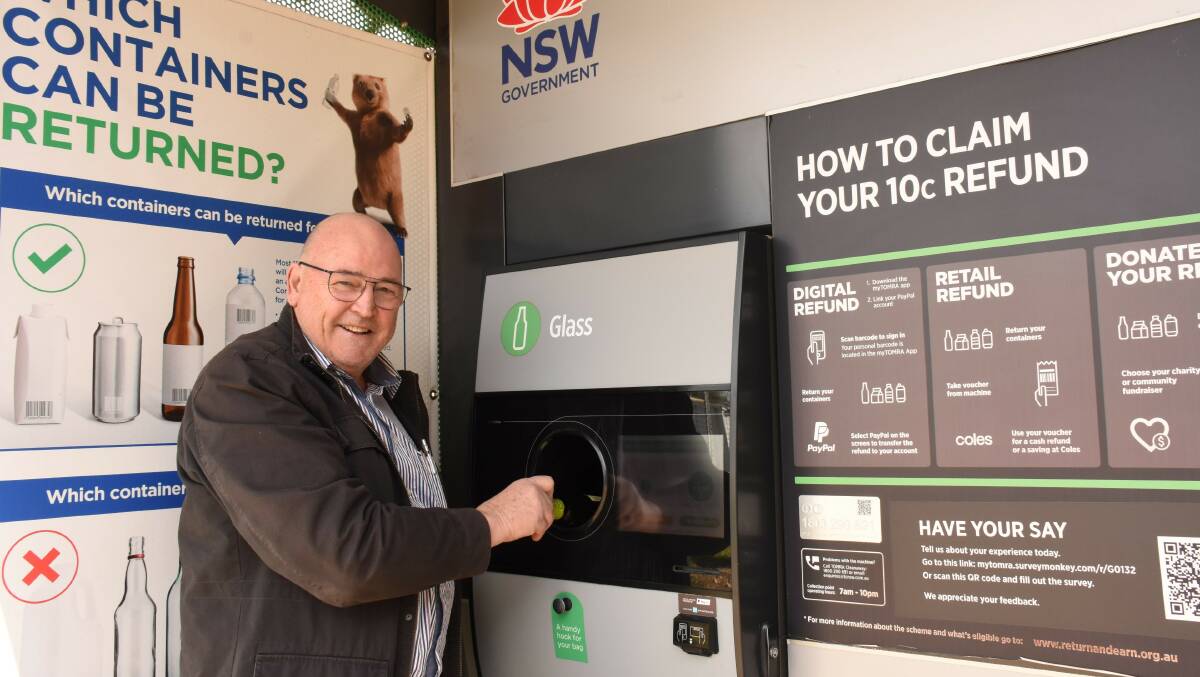 Tenterfield Care Centre chair Greg Sauer at the Return & Earn reverse vending machine. Donations so far have been slow.