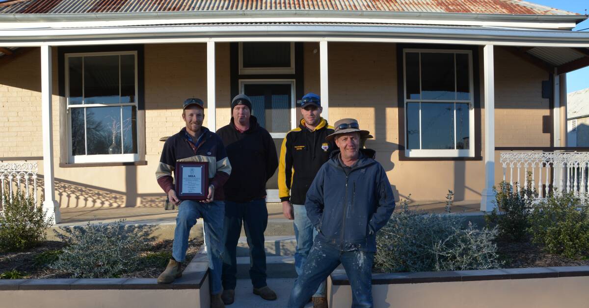 HERITAGE GEM: Pat Skinner, Blaike Brims, Murray Johnson and David Brown in front of the High St home that has scored the builder a second excellence award.