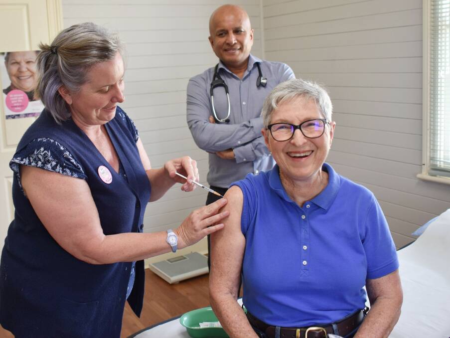 No pain here: Colleen Knight lines up for her COVID vaccination from Tenterfield Health Services nurse Nadine Blacker as Dr Sunil looks on. Photo: Donna Ward.