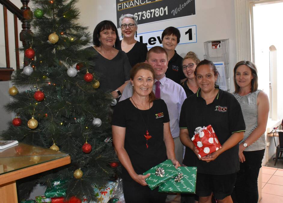 Definitely in the Christmas spirit are Corner Life and Style's Julie Hurtz and Judy Murphy, TDG's Zac Curry and Dannielle Williams, and TSDC's Karen Mooney, Billie-Anne Flint, Shahan McIntosh and Jo Crotty.