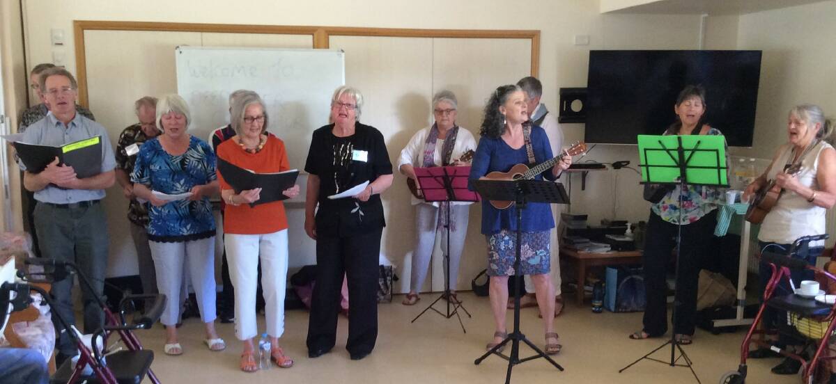 Christine Davis (ukulele in hand) leads the Cool Choir and ukulele group in a performance at Haddington Nursing Home.