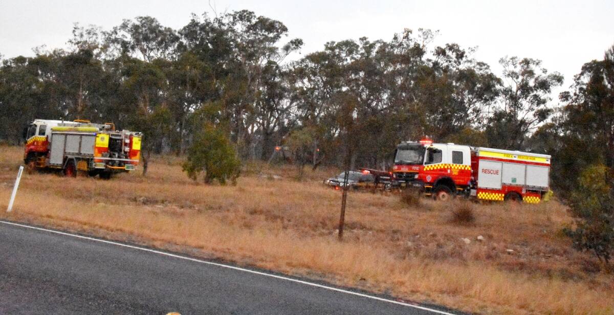 RFS crews are building new containment lines in the Sunnyside area west of New England Highway after winds blew a spot fire across existing lines on Tuesday night.