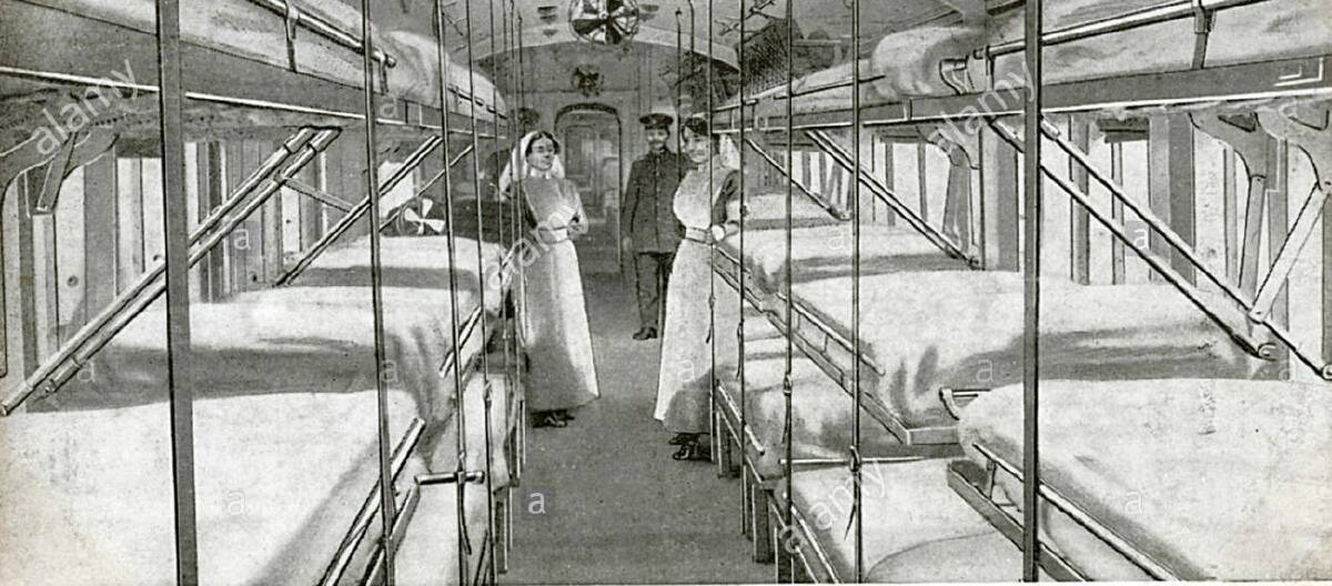 The interior of one of the ward cars of the ambulance train to convey wounded soldiers in France from the Front to the seaboard.