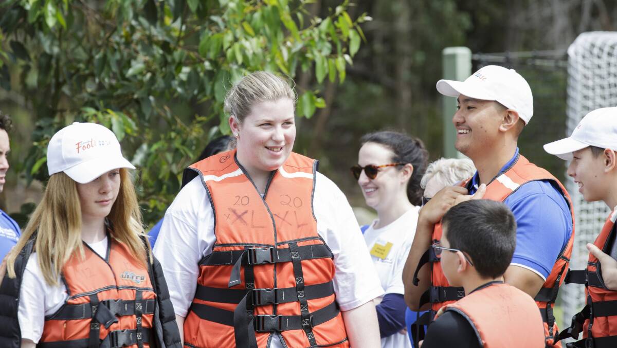 Chelsea Parker prepares for the raft-building challenge at this year's Camp Footloose for those suffering from Juvenile Idiopathic Arthritis.