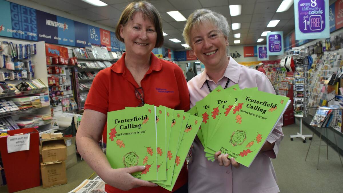 Sullivan's Newsagency's Trish Parker and Tenterfield Eisteddfod Committee secretary Ruth Offer with the new local phone books.
