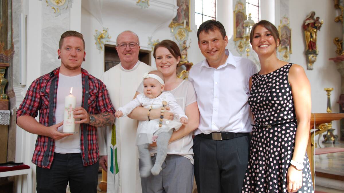 Father Gerard Hayes with Anya, Daniel and baby Ella Keller, with Anya's brother Stefan and Daniel's cousin Sarah (Elena's godfather and godmother) on the far left and right respectively.