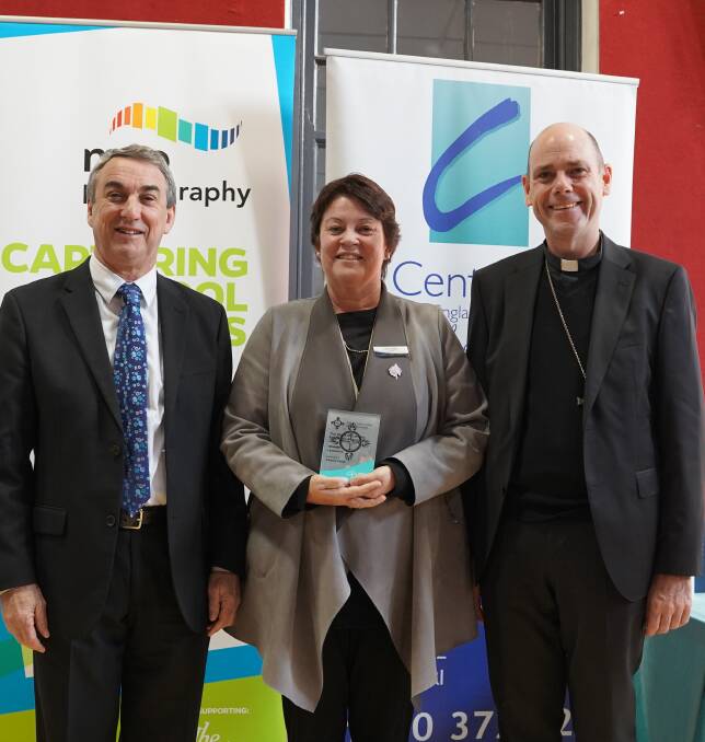 Director of Schools Chris Smyth with leadership award winner Cherie Yates and Bishop Michael Kennedy.