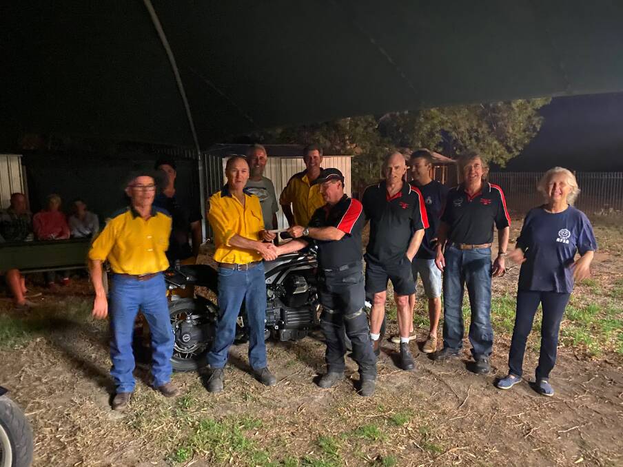 Andrew Hynes for Mingoola RFS received a generous donation from representatives of the Moto Guzzi Club of Queensland who annually rally in the district.