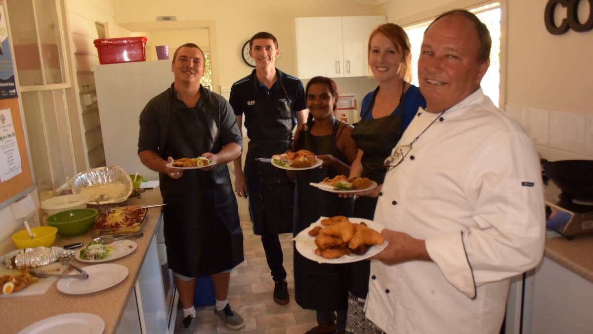 LUNCH IS SERVED: Colin Burgess, Adrian Cooper, Celeste Wilson, Cassie Gillon and chef Bill Floyd show off the results of their efforts.