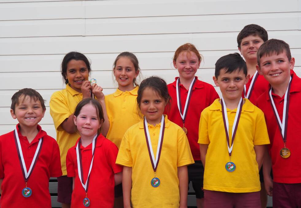 Age champions for 2018 are (back, from left) India Robinson Trindall, Maddison Purcell, Katelyn Wells and Liam Pitkin; and (front) Joseph Minchell, Hannah Godfrey, Ruby Kirk and Isaac Kirk.