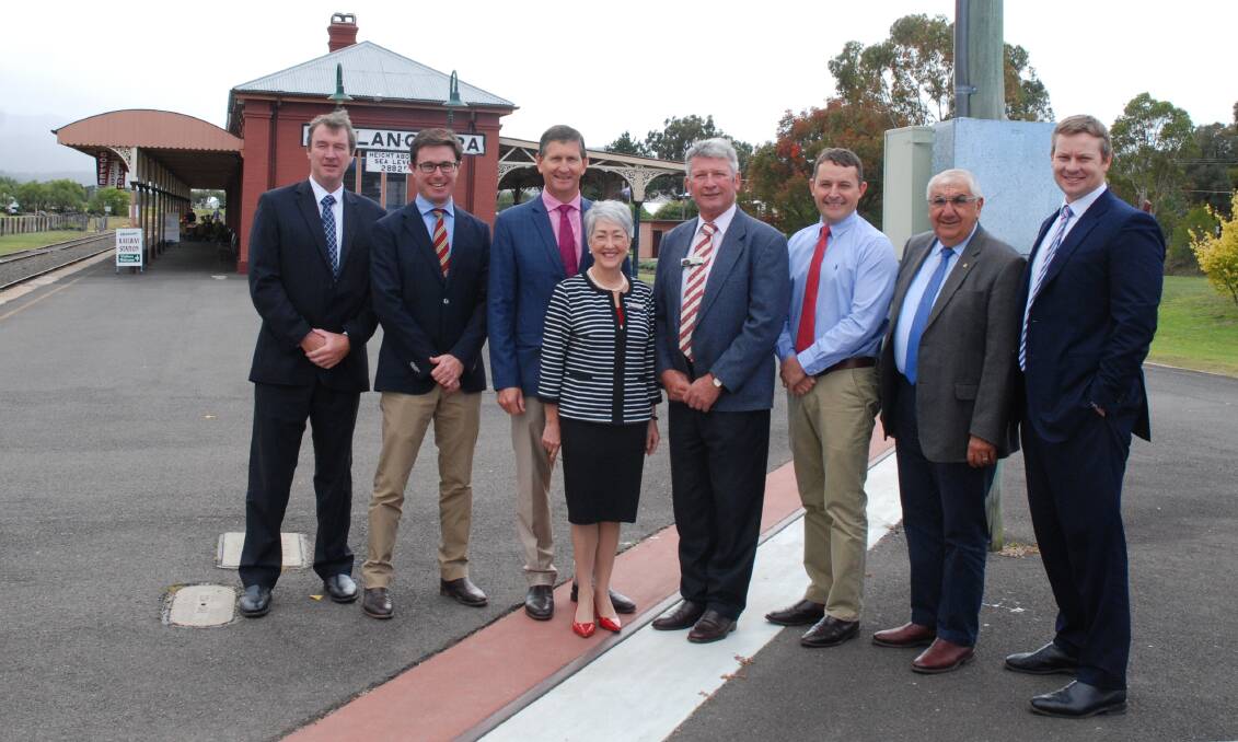 BORDERLINE: Southern Downs' CEO David Keenan, Federal member David Littleproud, state member Lawrence Springborg and mayor Tracie Dobie on the Qld side, with Tenterfield mayor Peter Petty, NSW Cross-Border Commissioner James McTavish, state member Thomas George and Tenterfield general manager Damien Connor from the NSW side.