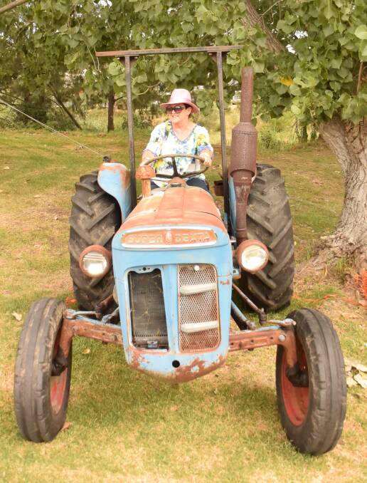 COLOUR COORDINATED: Noelene Faint was the sole lady vintage tractor driver in the grand parade.