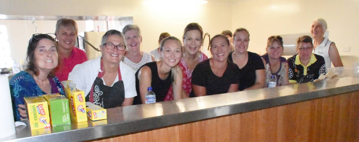 This happy crew of volunteers rotating through Tenterfield Memorial Hall are keeping firefighters and evacuees well-fed.