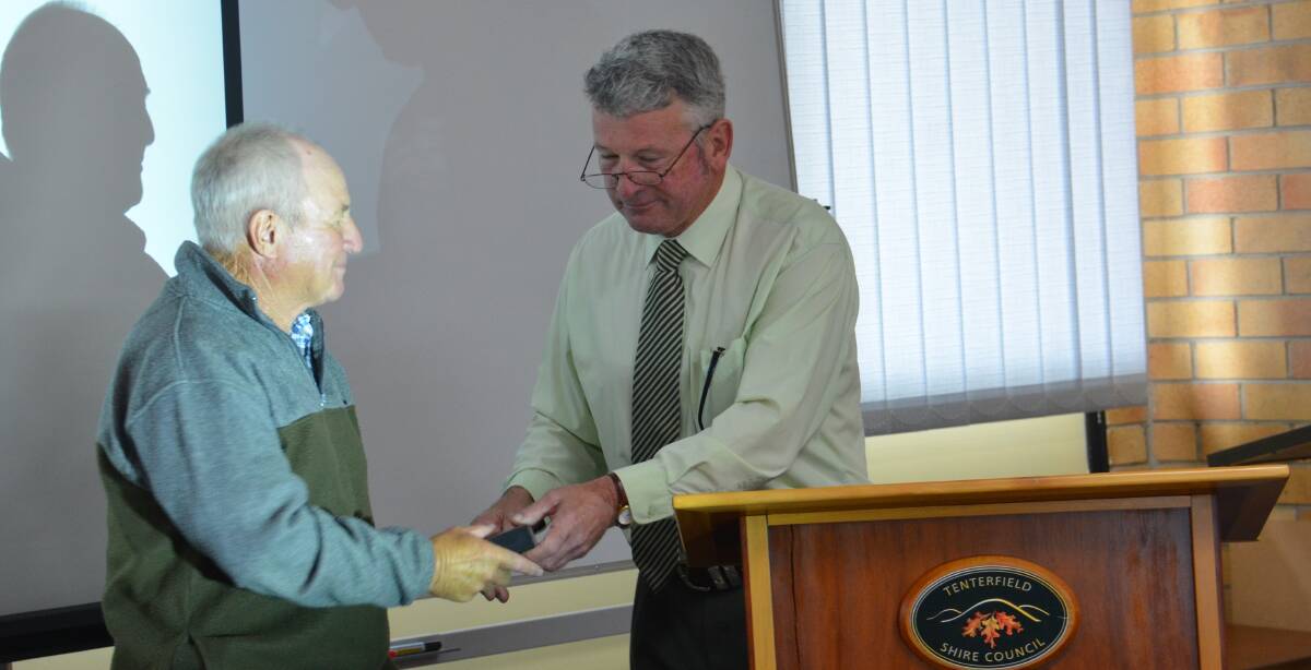 Allan 'Suey' Grogan gets an official sendoff from mayor Peter Petty after 34 years of service to council.
