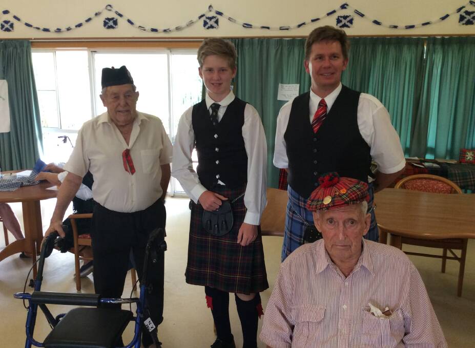 Travis O’Brien with dad Robert (from Glen Innes Pipe band) added their expertise to Haddington's St Andrew's Day celebrations, much to the delight of Max Taylor and Audley Smith.