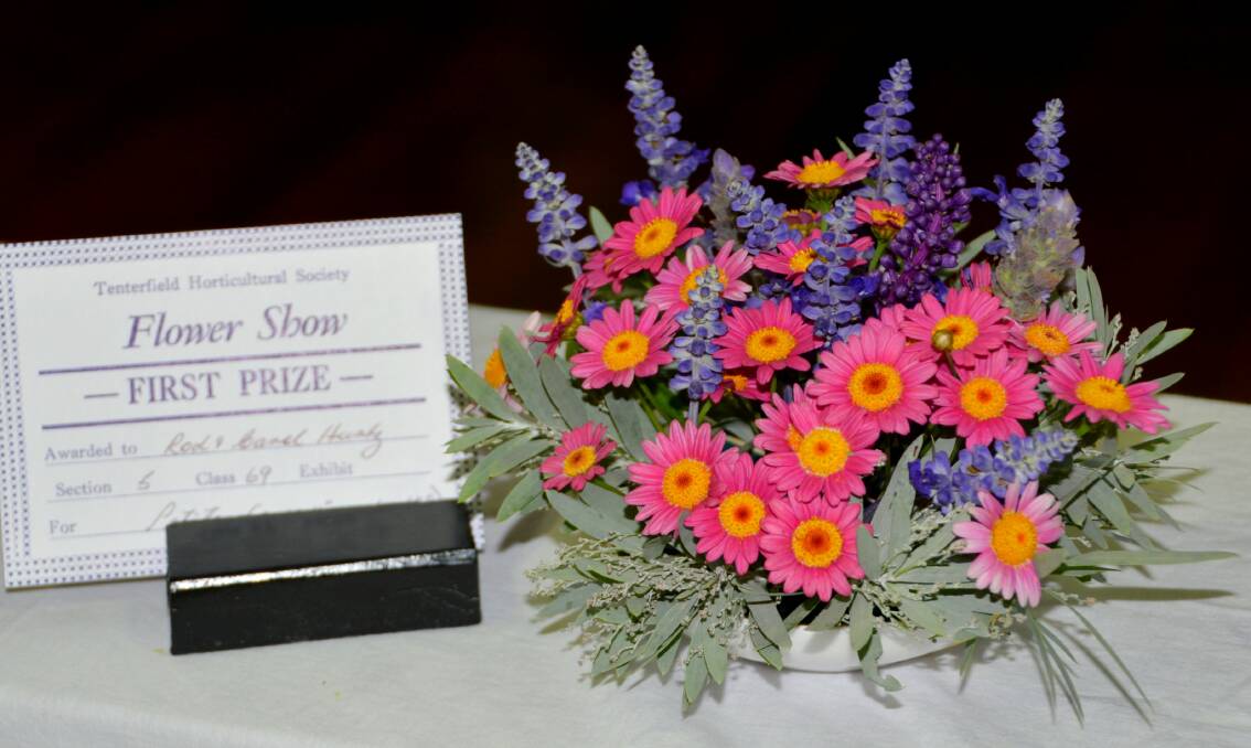 Floral art, such as this prize-winning arrangement by Rod and Carol Hurtz at last year's Dahlia and Cut Flower Show, is increasing in popularity among Tenterfield Horticultural Society members. The society is soon celebrating its 90th anniversary.