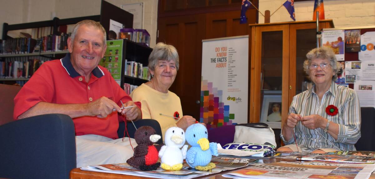 Legacy president John Munro rehones his knitting skills along with regular knitters Pam Brice and Vera Kerr.
