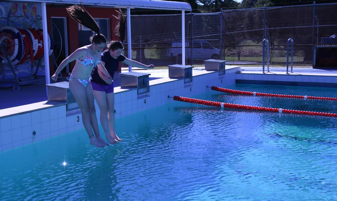 Jessica Davey and Sophia Searle dive into the new swimming season feet-first as the Tenterfield Pool opens.