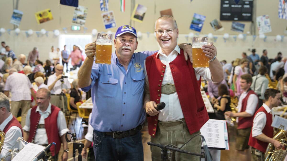 Rotary's Harry Bolton and bandmaster Reinhard ('Popeye') Lohr, where else but at the beerfest.