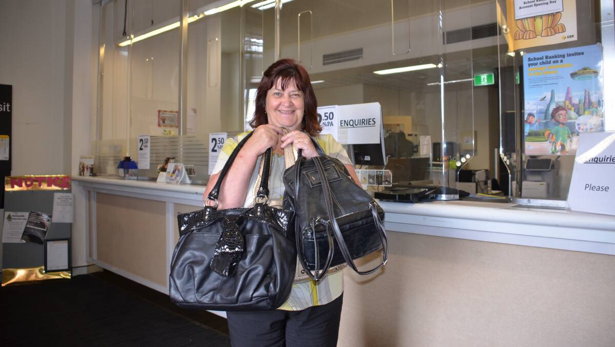 WITH DIGNITY: Commonwealth Bank's Debbie Minns with bagfuls of help for disadvantaged women.