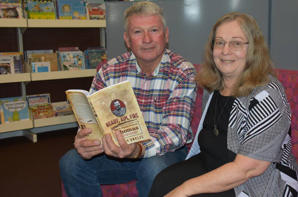 Mayor Peter Petty, pictured here with senior librarian Jenny Stoker, brought back a signed copy of 'Ready, Aim, Fire' from the launch to donate to the Tenterfield Library.
