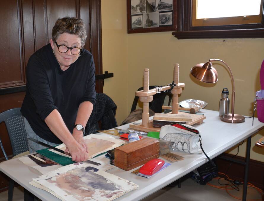 Artist in residence: Liz Powell working at the Tenterfield Railway Museum on Saturday. Photo: Melinda Campbell.