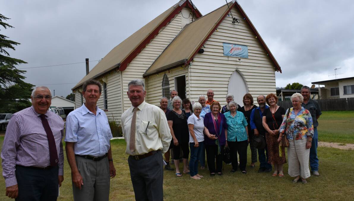 MP Thomas George, Pastor Jim Seymour, Mayor Peter Petty and part of the church congregation celebrate the grant funding.