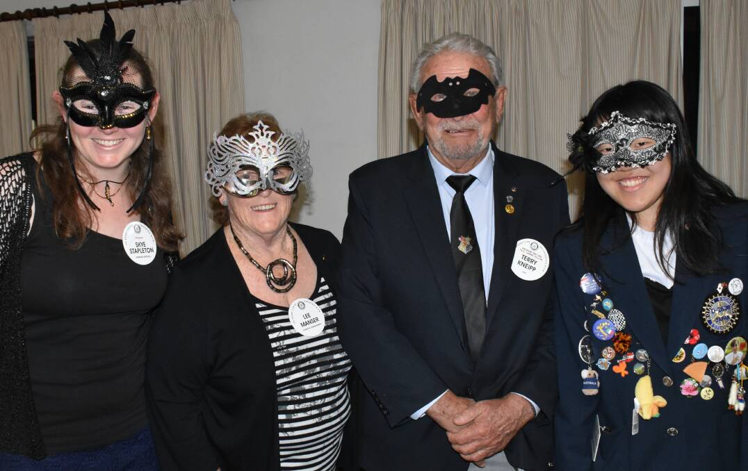 GUESS WHO? Club president Skye Stapleton with the masquerade winners Lee Manser, Terry Kneipp and Tsumiki Katsuragawa.
