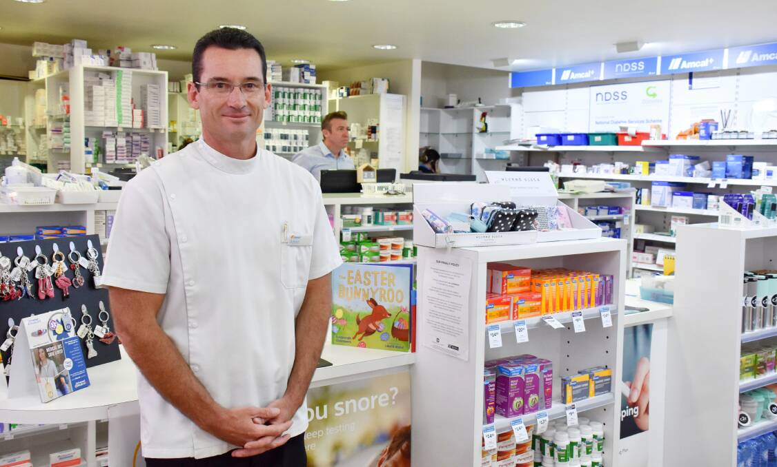 Pharmacist Adrian Ebbern of Tenterfield Amcal, which is taking COVID-19 precautions but remains a great source of assistance and advice.