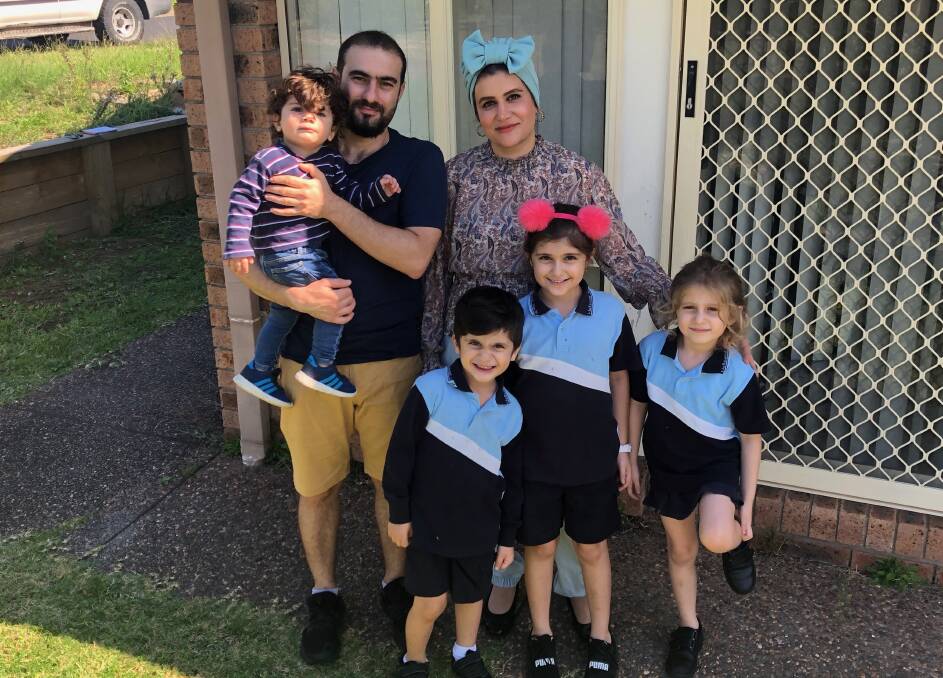 Sicking together: L-R Mohamed,2, Rashid Hejeejo and wife Alyaa Al-Attabi. Front L-R: Ryan, 5, Nadine, 6, and Yasmine, 8 at their home at Elemore Vale in Newcastle. 