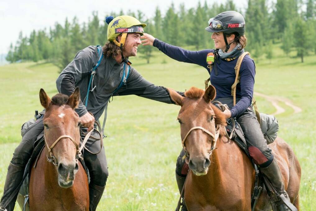 We did it: Adrian Corboy and Annabel Neasham celebrate their success in the Mongol Derby after an epic journey.