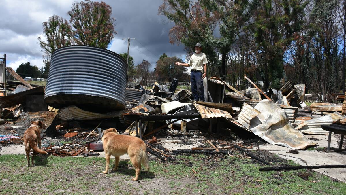 Noel Eveans stands on the ruins of what was his house. This has since been cleared away. Photo: Andrew Messenger