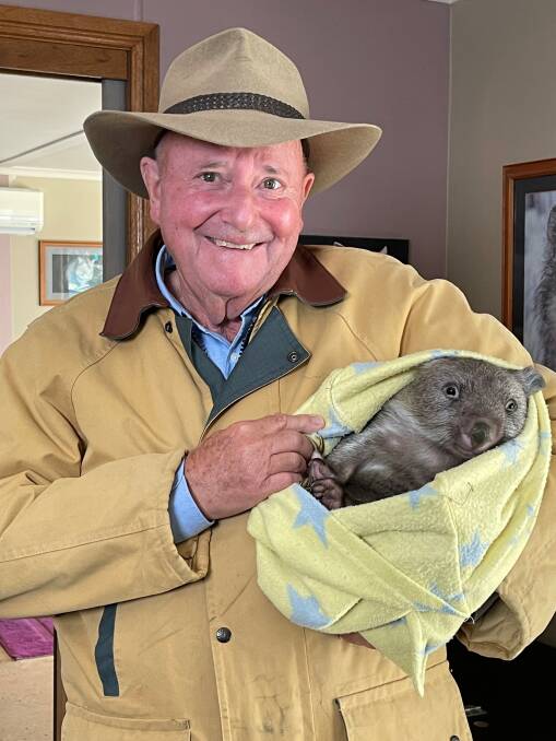 GREETED WITH A SMILE: Dr Harry Cooper recently filmed a segment for Better Homes and Gardens at Sleepy Burrows Wombat Sanctuary near Canberra. Pictures: supplied by Seven Network.