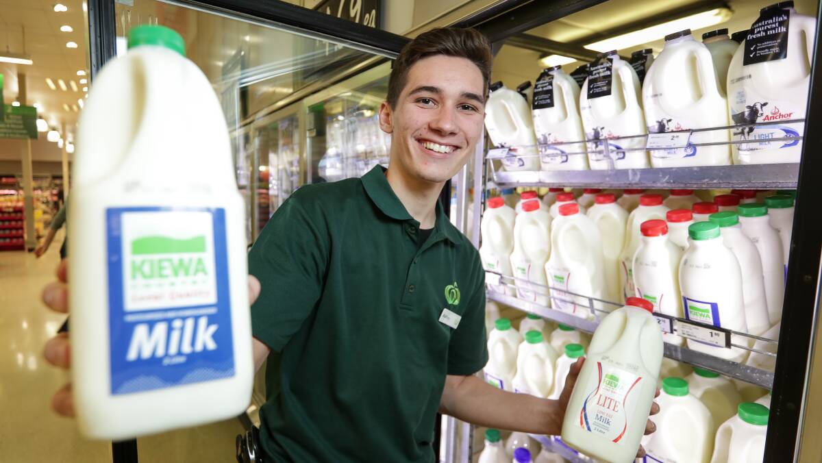 Woolworths Wodonga South staffer Ashley Benfield stocks the recently returned Kiewa Milk, now back in all major supermarkets. Picture: JAMES WILTSHIRE