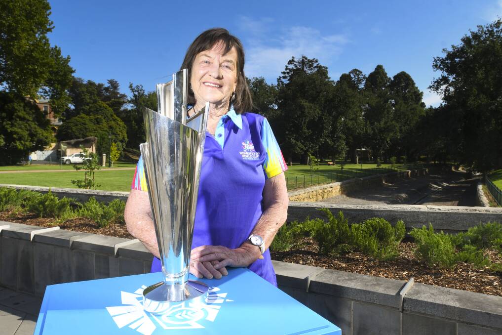 Judith Kidman with the Women's T20 World Cup trophy, which made an appearance in Bendigo on Wednesday. Picture: NONI HYETT