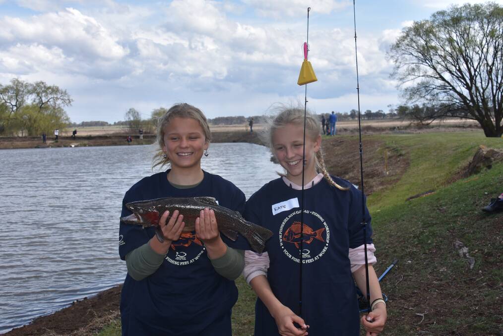 FISHING FUN: Jaslyn Ross and Katie Hodgson had come all the way from Coffs Harbour to attend the TroutFest. Photo: Nicholas Fuller