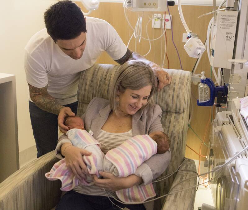 FAMILY TIME: Brett and Erin Pople with twins Darby and Remy, who were born nine weeks premature. Cameras installed at the hospital gave the family reassurance while the twins received treatment. 