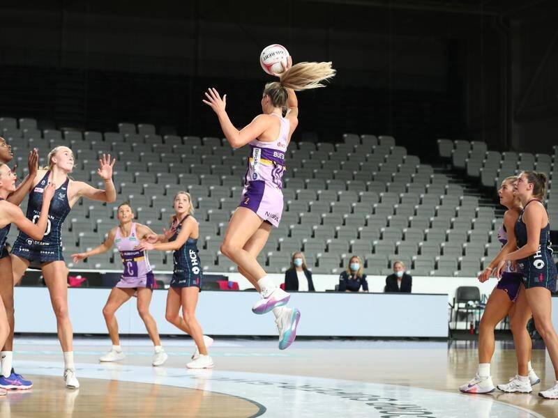 Gretel Bueta of the Firebirds in action during her side's Super Netball over the Melbourne Vixens.