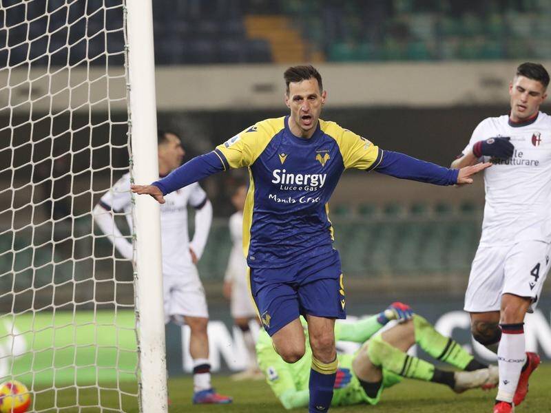 Verona's Nikola Kalinic celebrates his match-winning goal against visitors Bologna.