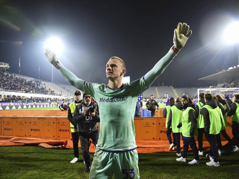 Fiorentina keeper Oliver Christensen celebrates his side's penalty shootout victory over Parma. (AP PHOTO)