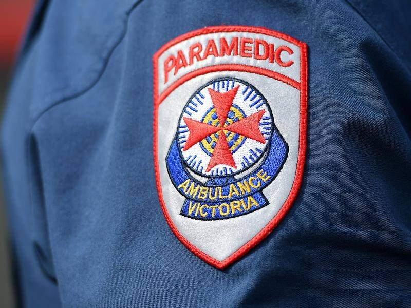 Paramedics were unable to save a Victorian man crushed between two vehicles on a rural property.