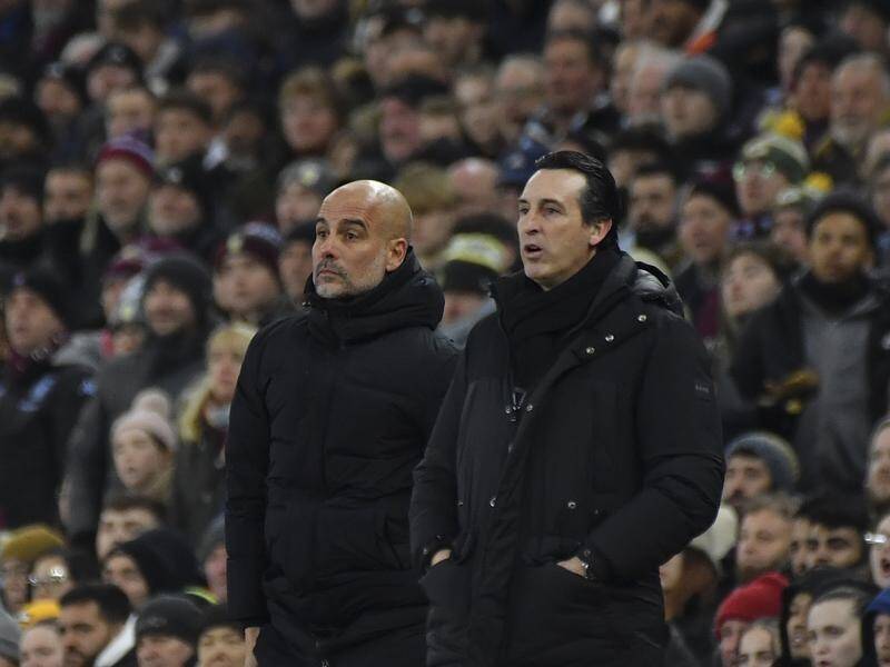 Unai Emery (right) has overseen victory over Pep Guardiola (left) for the first time in 14 attempts. (AP PHOTO)