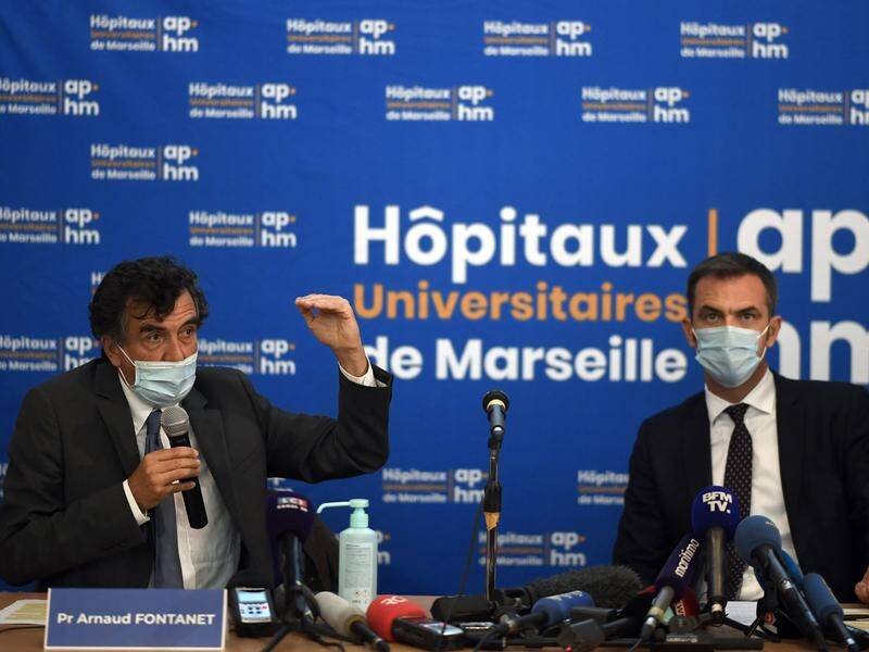 French scientist Arnaud Fontanet (L) says the coronavirus is spreading more rapidly in the cold.