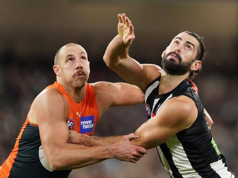 GWS coach Leon Cameron has defended the physicality of ruckman Shane Mumford (l).