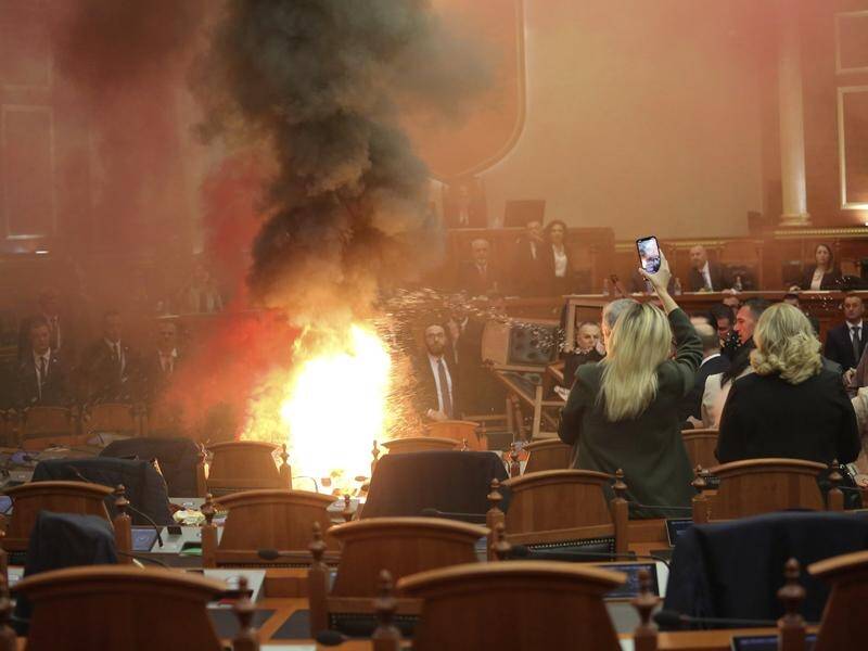 Opposition MPs piled chairs in the middle of the chamber, set off smoke bombs and lit a fire. (AP PHOTO)