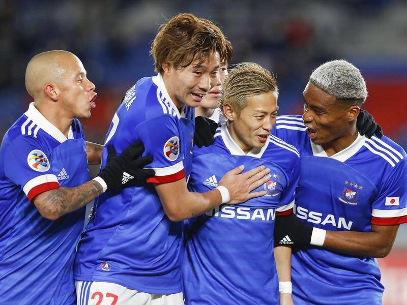 Yokohama players hail Teruhito Nakagawa (2nd right), after he netted in the 4-0 win over Sydney FC.
