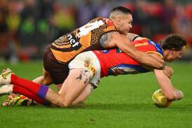 The AFL, after some coaching backlash, has made a call to change the holding-the-ball rule. (Morgan Hancock/AAP PHOTOS)