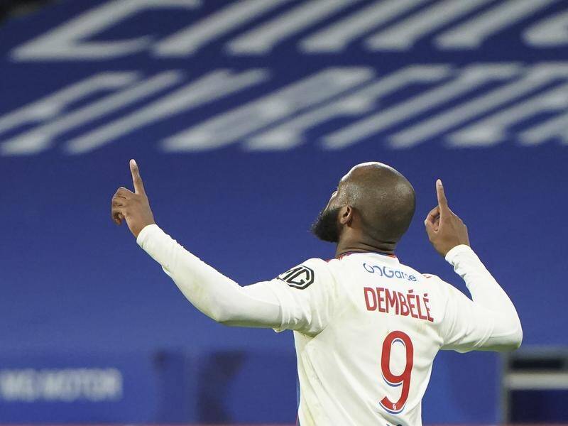 Lyon's Moussa Dembele celebrates his goal in their Ligue 1 derby defeat of Saint-Etienne.