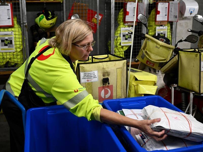 Posties have been flat out delivering millions of parcels as the festive season rush begins early. (Dan Himbrechts/AAP PHOTOS)