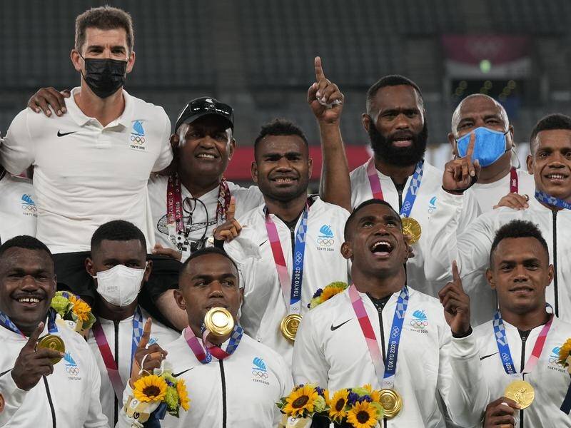 Fiji's rugby sevens squad have celebrated in Tokyo after winning consecutive Olympic gold medals.